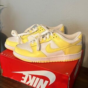 Nike dunk low white and soft yellow.